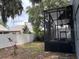 Exterior home view highlighting the spacious backyard and screened-in porch for outdoor enjoyment at 2061 Piedmont Park Blvd, Apopka, FL 32703
