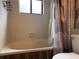 A practical bathroom with a bathtub, shower curtain, and fixtures, creating a functional and clean space at 2061 Piedmont Park Blvd, Apopka, FL 32703