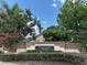 Community entrance sign to Piedmont Park with lush landscaping and trees at 2061 Piedmont Park Blvd, Apopka, FL 32703