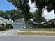 Charming single-story home with a well-maintained lawn, mature trees, and a two-car garage at 2061 Piedmont Park Blvd, Apopka, FL 32703