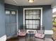 Cozy front porch with seating, offering a welcoming entrance to the home at 2061 Piedmont Park Blvd, Apopka, FL 32703