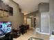 Inviting living area with a TV, dining table, and open layout perfect for modern living at 2061 Piedmont Park Blvd, Apopka, FL 32703