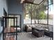 Enclosed patio featuring cozy seating, providing a comfortable spot for outdoor relaxation and entertaining at 2061 Piedmont Park Blvd, Apopka, FL 32703
