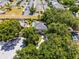 An aerial view of the home with mature trees, a pool and a well kept surrounding neighborhood at 207 Via Tuscany Loop, Lake Mary, FL 32746