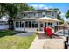Serene backyard with a well-manicured lawn, a patio area, and a private pool with a safety fence at 207 Via Tuscany Loop, Lake Mary, FL 32746