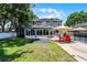 Beautiful backyard featuring a well-maintained lawn, pool with safety fence, and a patio area at 207 Via Tuscany Loop, Lake Mary, FL 32746