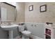 Well-decorated half bathroom with modern fixtures and stylish wallpaper at 207 Via Tuscany Loop, Lake Mary, FL 32746