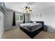 Comfortable bedroom with plush carpeting, ceiling fan, and a large window for natural light at 207 Via Tuscany Loop, Lake Mary, FL 32746