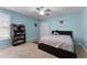 Bright bedroom with blue walls, a ceiling fan, and neutral carpet at 207 Via Tuscany Loop, Lake Mary, FL 32746
