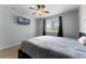 Cozy bedroom features plush carpeting, ceiling fan, and a window with exterior views at 207 Via Tuscany Loop, Lake Mary, FL 32746