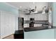 Well-appointed kitchen featuring white cabinets, stainless appliances, and a breakfast bar at 207 Via Tuscany Loop, Lake Mary, FL 32746