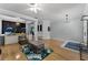 Spacious living room with hardwood floors, a ceiling fan, and a custom-built play area for children at 207 Via Tuscany Loop, Lake Mary, FL 32746