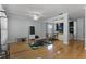 Spacious living room with hardwood floors, a ceiling fan, and a custom-built play area for children at 207 Via Tuscany Loop, Lake Mary, FL 32746