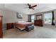 Comfortable main bedroom with neutral walls, carpet, ceiling fan, and plenty of natural light at 207 Via Tuscany Loop, Lake Mary, FL 32746