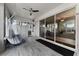 Spacious sunroom with hanging chairs, tile flooring, and sliding glass doors leading to the outdoors at 207 Via Tuscany Loop, Lake Mary, FL 32746