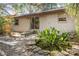 Backyard patio, fire pit, mature landscaping and fish pond at 241 Ruth Blvd, Longwood, FL 32750