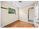 Bright room featuring hardwood floors, a window with natural light, and a doorway to an adjacent room at 241 Ruth Blvd, Longwood, FL 32750