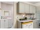 Kitchen area with sink, ample cabinet space, and vanity sink at 241 Ruth Blvd, Longwood, FL 32750
