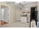 View of the kitchen area from the living space, with sink, cabinets, and compact refrigerator at 241 Ruth Blvd, Longwood, FL 32750