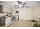 Kitchen with grey cabinets, compact refrigerator, and ceiling fan at 241 Ruth Blvd, Longwood, FL 32750