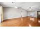 Bright living room with vaulted ceiling, hardwood floors, and decorative wood front door at 241 Ruth Blvd, Longwood, FL 32750