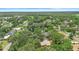 Neighborhood aerial view showcases homes surrounded by mature trees and landscaping at 2678 Wilmhurst Rd, Deland, FL 32720