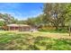 Expansive backyard with above ground pool, mature trees, and partially fenced yard at 2678 Wilmhurst Rd, Deland, FL 32720