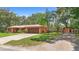 Charming single Gathering home with mature trees, neutral colors, and attached two car garage at 2678 Wilmhurst Rd, Deland, FL 32720
