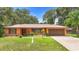 Charming single-story home features well-manicured front lawn and attached garage at 2678 Wilmhurst Rd, Deland, FL 32720