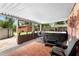 Covered patio with a Wellis hot tub, outdoor furniture and view of the backyard at 2678 Wilmhurst Rd, Deland, FL 32720