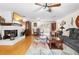 Spacious living room area includes hardwood floors, fireplace, and dining area at 2678 Wilmhurst Rd, Deland, FL 32720