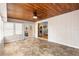 Sunroom with wood paneled ceiling, tile flooring, and french doors at 2678 Wilmhurst Rd, Deland, FL 32720