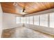 Comfortable sunroom with wood paneled ceiling, neutral paint color, and tile floor at 2678 Wilmhurst Rd, Deland, FL 32720