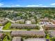 Expansive aerial view showing a well-maintained property with mature trees at 3247 Forest Oaks Ct # 116, Winter Park, FL 32792
