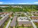 Wide aerial view showcasing the property and surrounding lush green areas at 3247 Forest Oaks Ct # 116, Winter Park, FL 32792