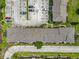 Aerial view of the complex showing the building, parking, and landscaping at 3247 Forest Oaks Ct # 116, Winter Park, FL 32792