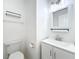 Well-lit bathroom with a modern vanity, mirror, and fixtures and toilet at 3247 Forest Oaks Ct # 116, Winter Park, FL 32792