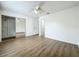 Spacious main bedroom with ceiling fan, wood floors and closet at 3247 Forest Oaks Ct # 116, Winter Park, FL 32792