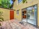 Tiled patio area featuring a sliding glass door and a painted door at 3247 Forest Oaks Ct # 116, Winter Park, FL 32792