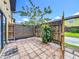 Cozy outdoor patio with tile floor and privacy fence at 3247 Forest Oaks Ct # 116, Winter Park, FL 32792