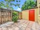 Private patio features pavers, storage shed and landscaping at 3247 Forest Oaks Ct # 116, Winter Park, FL 32792