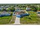 An aerial view shows the home surrounded by a white fence in a peaceful neighborhood at 3256 Amber St, Deltona, FL 32738