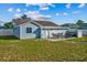 Backyard patio featuring outdoor seating, hot tub, and well-maintained fencing creating a cozy retreat at 3256 Amber St, Deltona, FL 32738