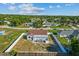 An aerial view showcases the backyard, featuring a patio with furniture, and surrounded by fences for privacy at 3256 Amber St, Deltona, FL 32738
