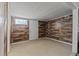 A clean basement with wood paneled walls and neutral carpeting at 3256 Amber St, Deltona, FL 32738