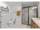 Stylish bathroom with a toilet, a glass-enclosed marble shower, and a vanity with a marble top, designed for comfort at 3256 Amber St, Deltona, FL 32738