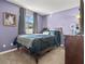 Relaxing bedroom with a window, grey walls, and minimalist furnishings, creating a peaceful and calming atmosphere at 3256 Amber St, Deltona, FL 32738