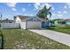 Charming single-story home features a two-car garage, driveway and well-maintained lawn at 3256 Amber St, Deltona, FL 32738