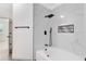 Modern bathroom features a soaking tub, tiled shower with rainfall showerhead, and sleek black fixtures at 3280 Soho St # 306, Orlando, FL 32835