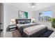 Cozy bedroom with a plush bed, stylish lamps, and a large window for natural light at 3280 Soho St # 306, Orlando, FL 32835
